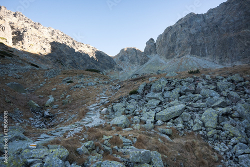 Obraz na płótnie Travel along a marked mountain trail in the High Tatras. Landscape of high mountains.
w salonie