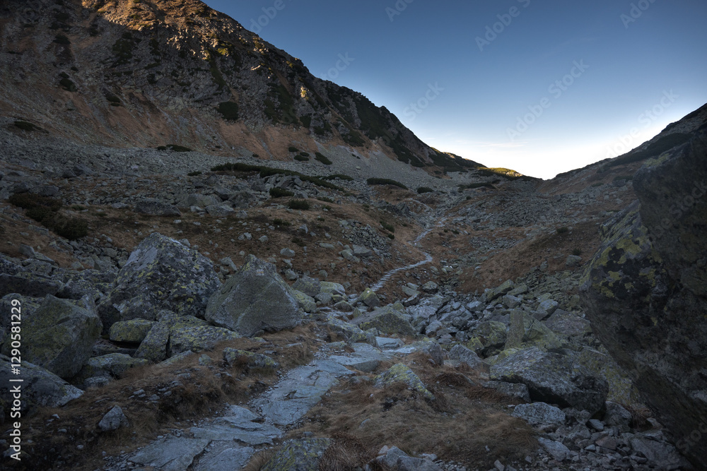 Travel along a marked mountain trail in the High Tatras. Landscape of high mountains.
Travel along a marked mountain trail in the High Tatras. Landscape of high mountains.