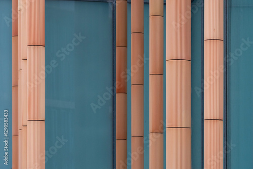 Architectural abstract of a building with blue glass and terracotta panels. photo