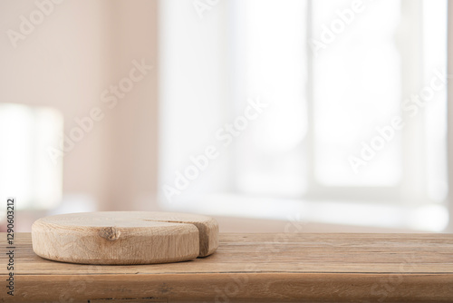 Fotografia Empty podium on wooden table with blur room and window interior background for d