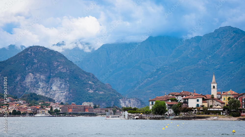 Beautiful coastline view of Isola Superiore in Italy with mountains and charming architecture Beautiful coastline view of Isola Superiore in Italy with mountains and charming architecture