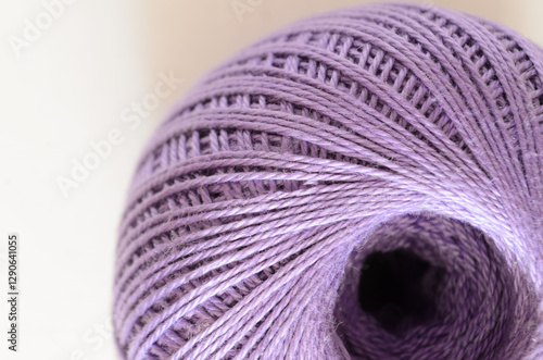 Closeup of purple thread spool with detailed texture