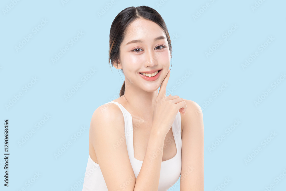 Beauty concept portrait of young Asian woman with K beauty make up style on isolated blue background. Facial and skin care concept for commercial advertising. Beauty concept portrait of young Asian woman with K beauty make up style on isolated blue background. Facial and skin care concept for commercial advertising.