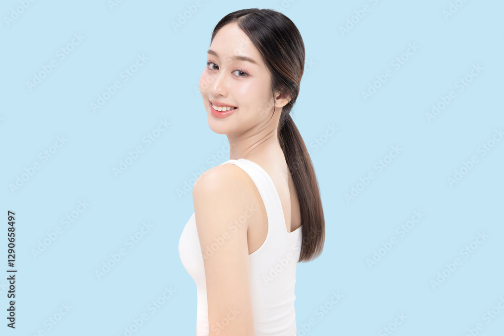 Beauty concept portrait of young Asian woman with K beauty make up style on isolated blue background. Facial and skin care concept for commercial advertising. Beauty concept portrait of young Asian woman with K beauty make up style on isolated blue background. Facial and skin care concept for commercial advertising.