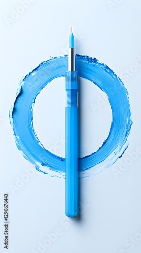 Blue Pen in a Circular Blue Paint Stroke on Light Blue Background Artistic Stationery Concept