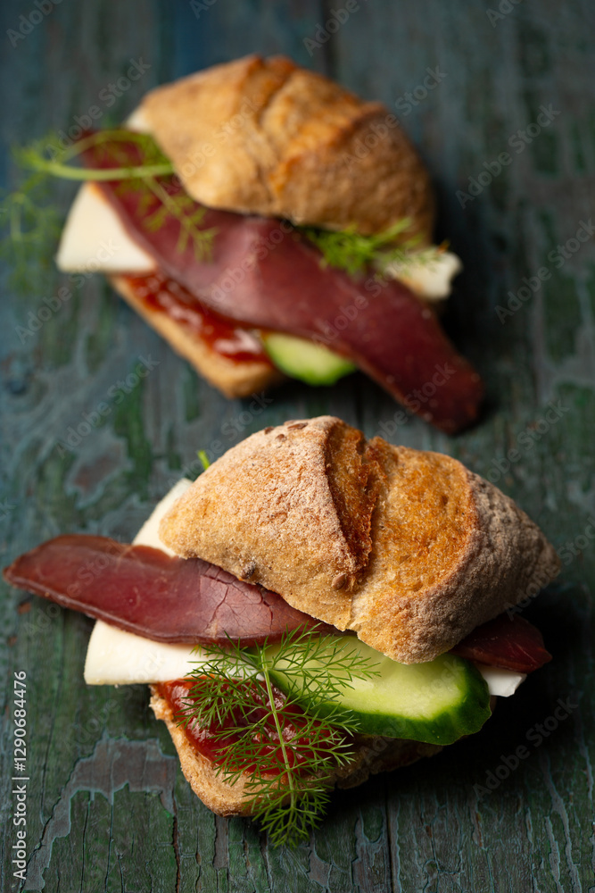 Two small sandwiches with basturma and cucumber