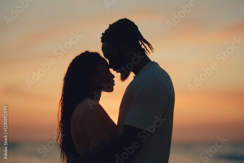Romantic couple embracing at sunset on beach