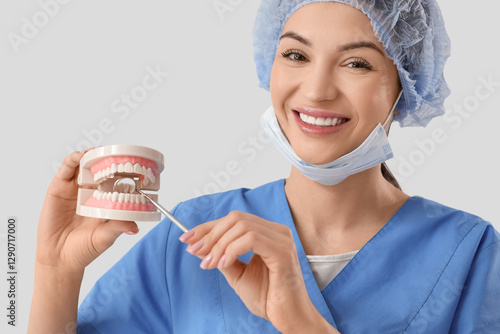 Smiling female dentist in s...