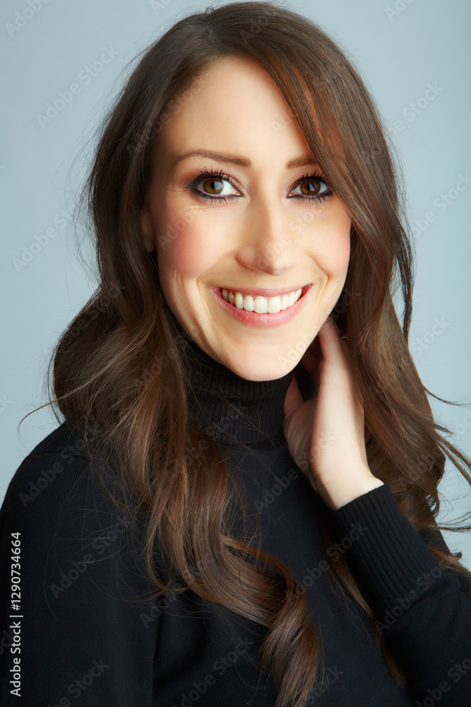Portrait, woman and smile in studio for hair care, cosmetics and treatment benefits of keratin. Happiness, female person and model with beauty for smooth shine, curls wellness and gray background Portrait, woman and smile in studio for hair care, cosmetics and treatment benefits of keratin. Happiness, female person and model with beauty for smooth shine, curls wellness and gray background
