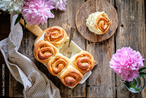 buns with peaches and poppy seeds. Top view, wooden background