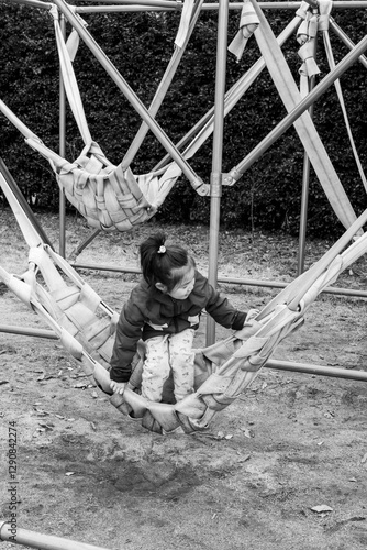 Little girl playing on the athletic field photo