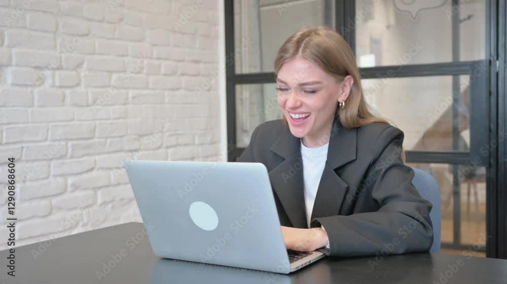 Businesswoman Celebrating Success on Laptop in Office Businesswoman Celebrating Success on Laptop in Office