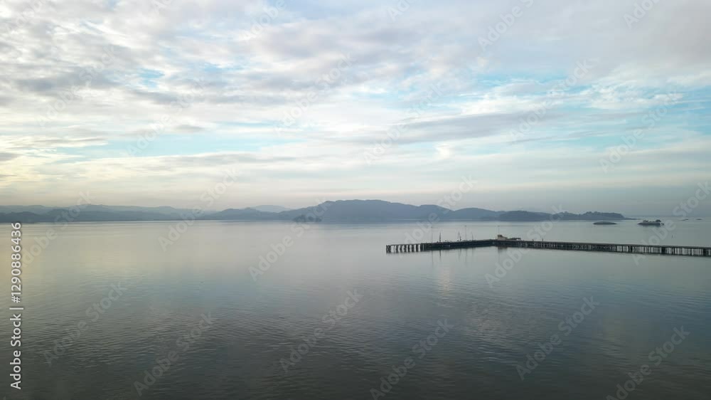 Stunning aerial overview of reflecting water below piers with distant mountains, Point Molate Beach Richmond California USA Stunning aerial overview of reflecting water below piers with distant mountains, Point Molate Beach Richmond California USA