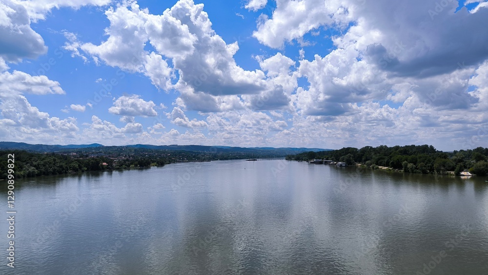 blue sky with white clouds reflected in y=the Danube river in Novi Sad blue sky with white clouds reflected in y=the Danube river in Novi Sad