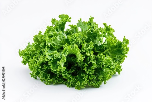 Fresh green leafy vegetables arranged on a white surface