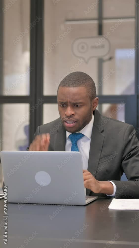 African Businessman Shocked by Loss on Laptop African Businessman Shocked by Loss on Laptop