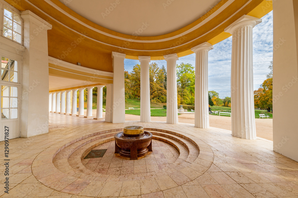 Marianske Lazne, Czech Republic - October 8, 2023: Classical colonnade with a spring in the middle, surrounded by autumn nature.