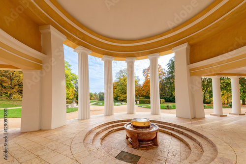 Marianske Lazne, Czech Republic - October 8, 2023: Classical colonnade with a spring in the middle, surrounded by autumn nature. 