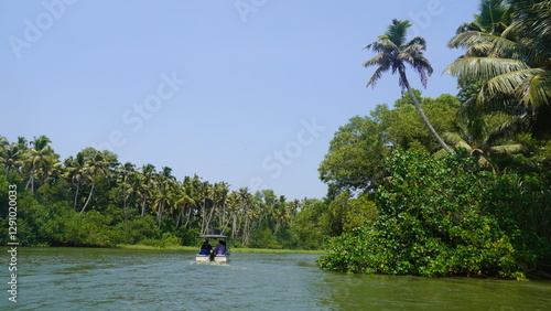 people boating on river in poovar island photo