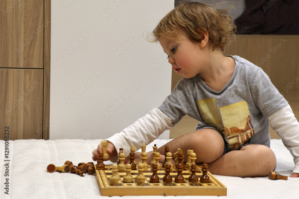 child plays chess
