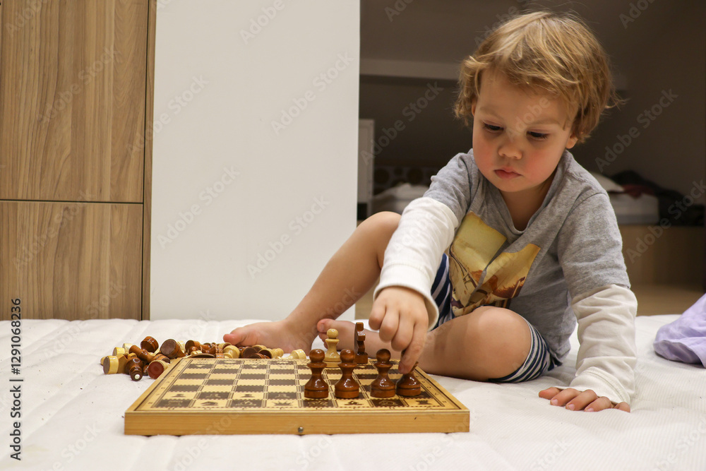 child plays chess