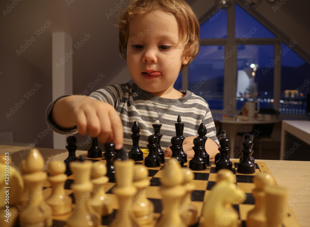 child plays chess