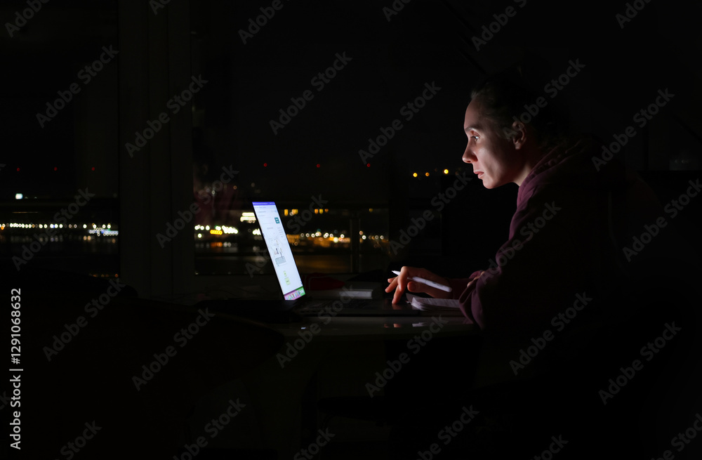 woman sitting at laptop