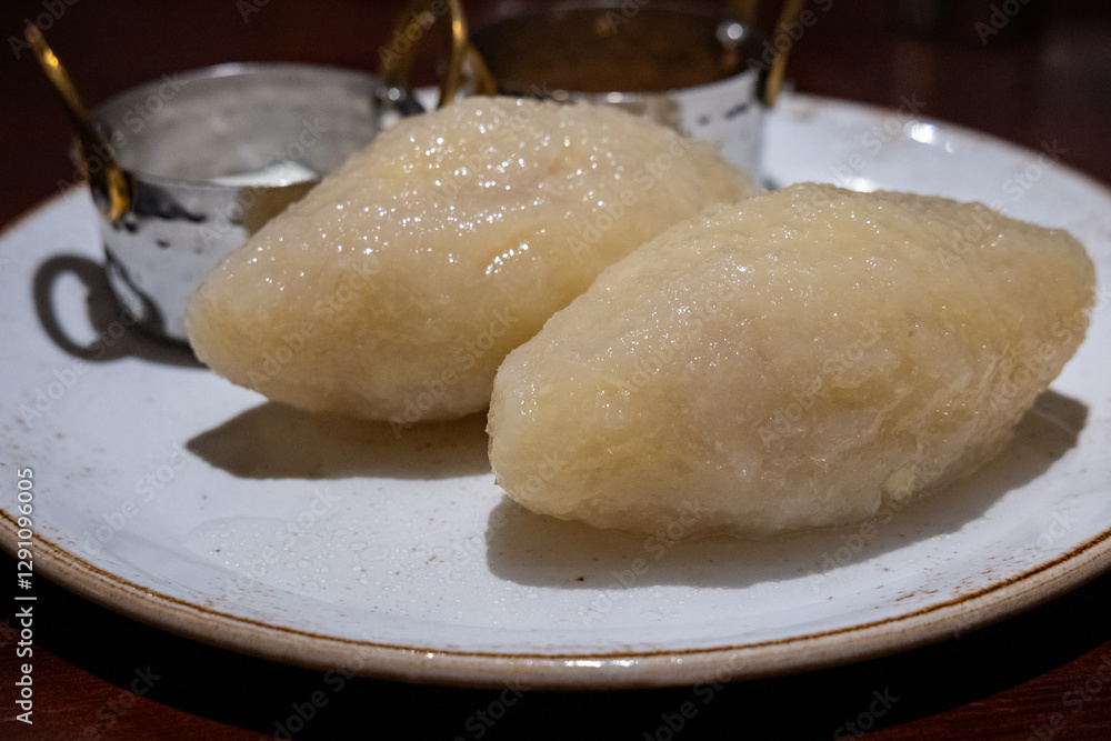 Large potato dumplings called Cepelinai - one of the dishes of traditional lithuanian cuisine. Also known in Poland and called Cepeliny or Kartacze