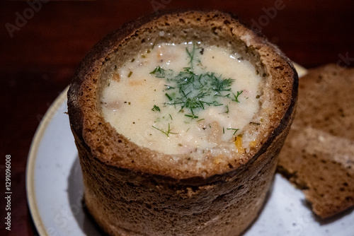Mushroom soup served in bread, one of the dishes of traditional lithuanian cuisine