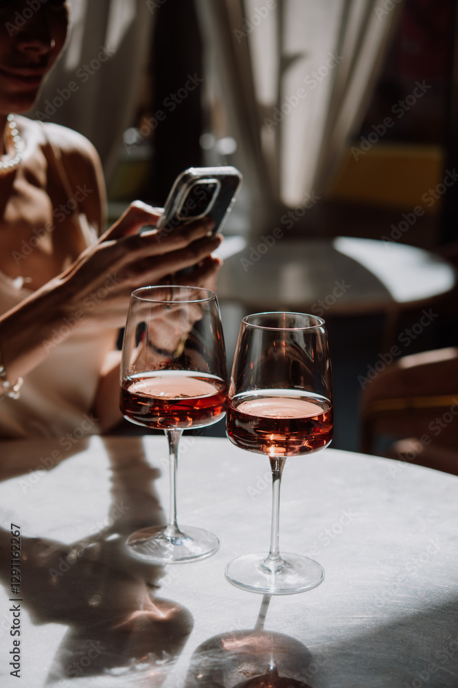 Glasses of rose wine seen during a friendly party or a celebration in a restaurant of a bar.