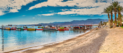 Floating pier with anchored different models of pleasured and rental boats an...
