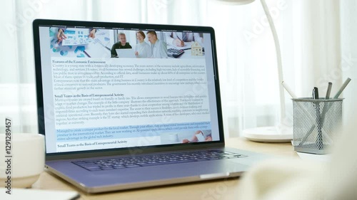 Online news site using laptop screen. People reading electronic newspaper on desktop. Mass media on digital platform.