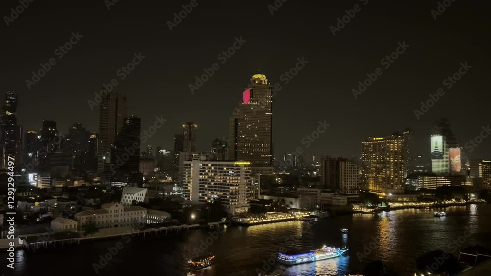 Night view of riverside Bangkok with city lights, river boats, and glowing skyscrapers Night view of riverside Bangkok with city lights, river boats, and glowing skyscrapers