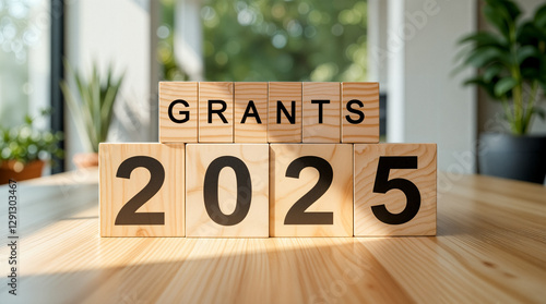 wooden blocks spelling grants 2025 on table