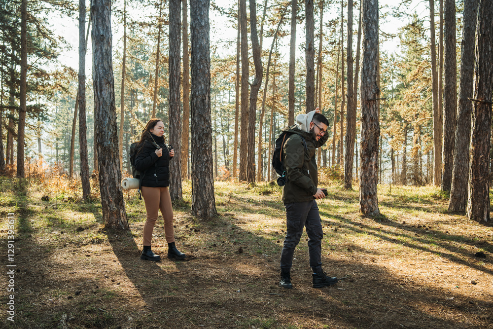 Young caucasian couple boyfriend and girlfriend set up tent camp in the forest
Young caucasian couple boyfriend and girlfriend set up tent camp in the forest