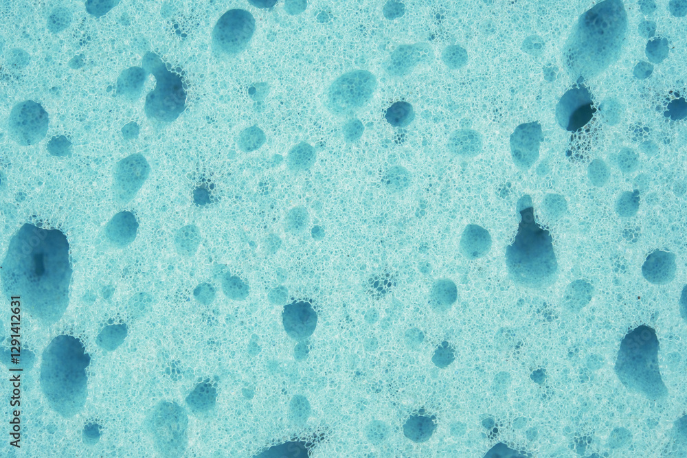 Close up of a blue sponge, sponge texture as a background. Close up of a blue sponge, sponge texture as a background.