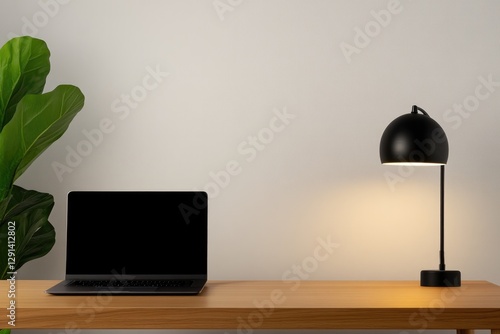 Minimalist workspace features sleek laptop, stylish lamp, and lu