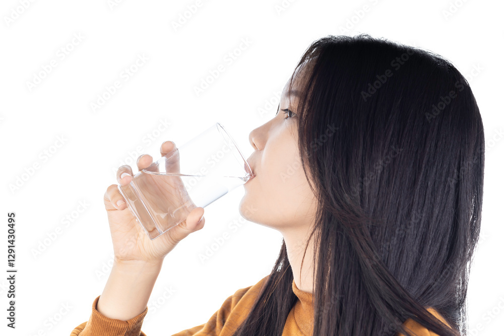 Young Asian woman drinking clean water from a glass isolated on white background with clipping path. Young Asian woman drinking clean water from a glass isolated on white background with clipping path.
