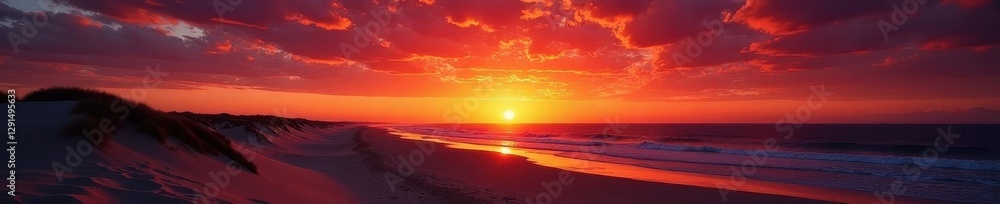 Fototapeta premium Dramatic sunset over Glenelg Beach; silhouetted dunes against fiery sky , twilight, evening, vibrant