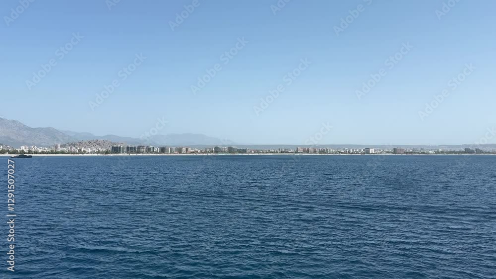 Stunning views of the sea and mountains in Antalya, Turkey, where the blue waters meet the scenic landscape of the city, creating a perfect harmony of nature and urban life. Stunning views of the sea and mountains in Antalya, Turkey, where the blue waters meet the scenic landscape of the city, creating a perfect harmony of nature and urban life.