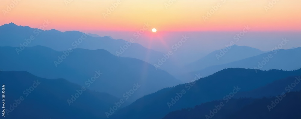 Obraz premium Misty dawn breaks over layered blue mountains under a soft gradient sky, peaceful, foggy