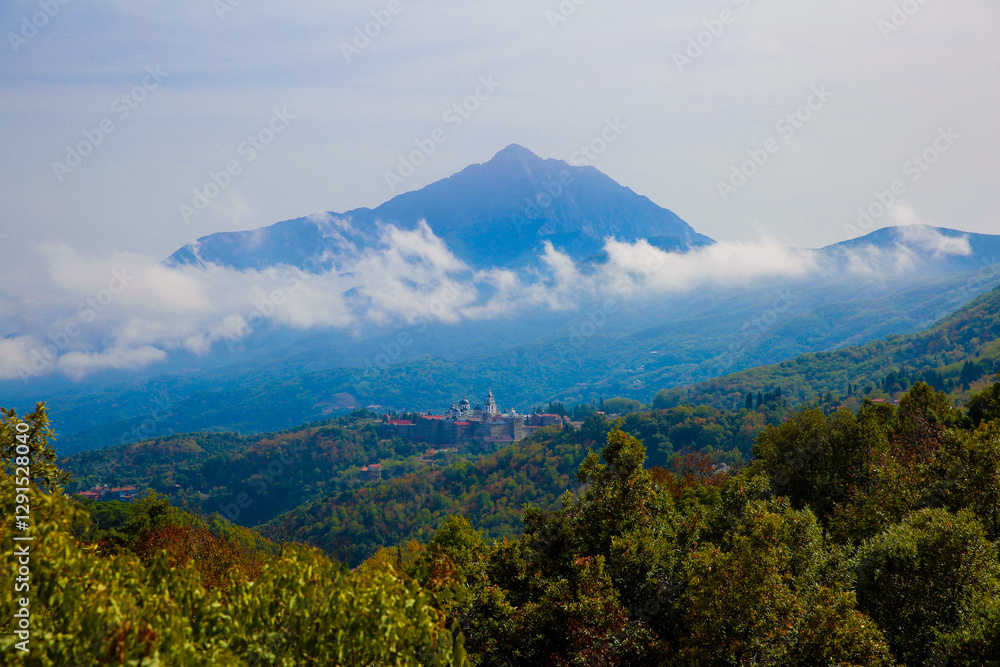 Fototapeta premium Skete of St. Andrew the First-Called in Karyes with Mount Athos in the background, Greece.