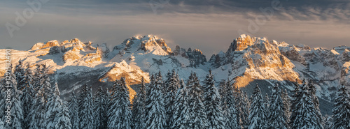 At Malga Ritorto, a splendid balcony over the entire Brenta Dolomites chain, here shot with the last lights of sunset, Brenta Dolomites, Madonna di Campiglio, Trentino, Italy