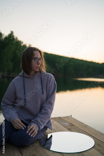 Woman on the pier at lake