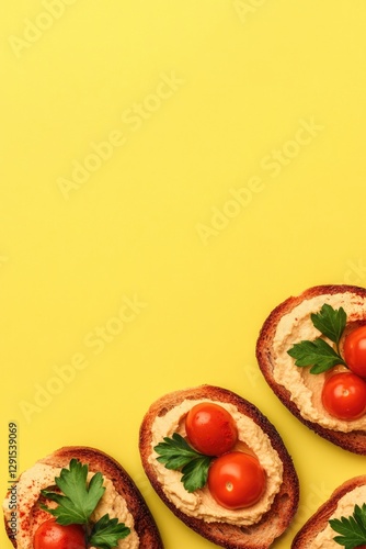 Bright yellow backdrop highlights delicious toasted bread topped