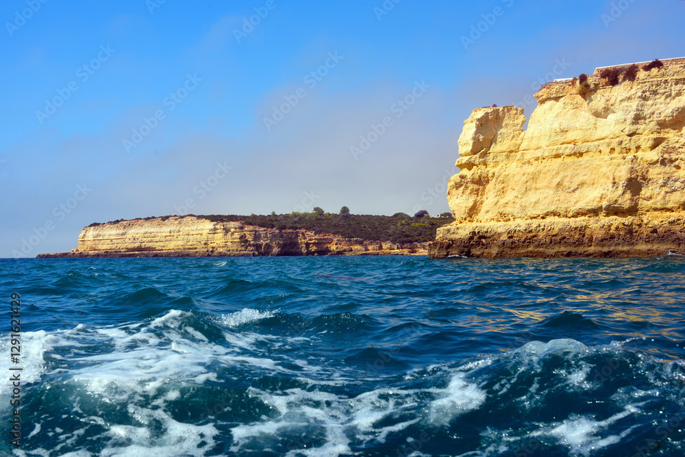 The Algarve Rocks Formation is a unique and stunning natural wonder located in the coastal town of Porches Portugal The Algarve Rocks Formation is a unique and stunning natural wonder located in the coastal town of Porches Portugal
