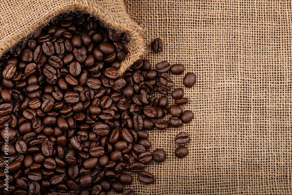 A burlap sack spills freshly roasted coffee beans onto a textured surface, highlighting their rich, dark color and natural sheen. A burlap sack spills freshly roasted coffee beans onto a textured surface, highlighting their rich, dark color and natural sheen.
