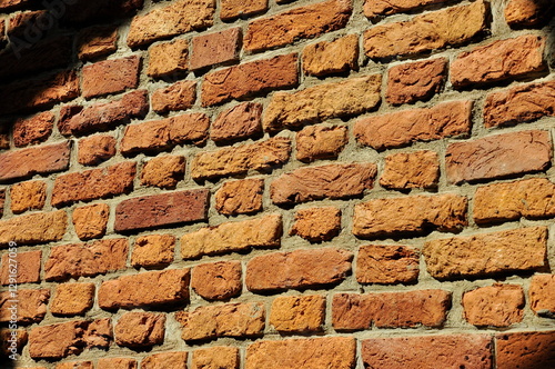 Texture, wallpaper, sunlight falls on a red brick wall