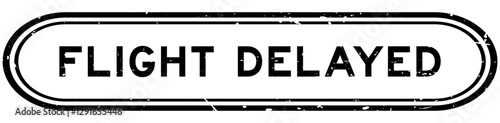 Grunge black flight delayed word rubber seal stamp on white background