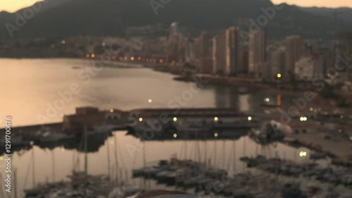 Two seagulls against the background of the evening city of Calpe, Spain.